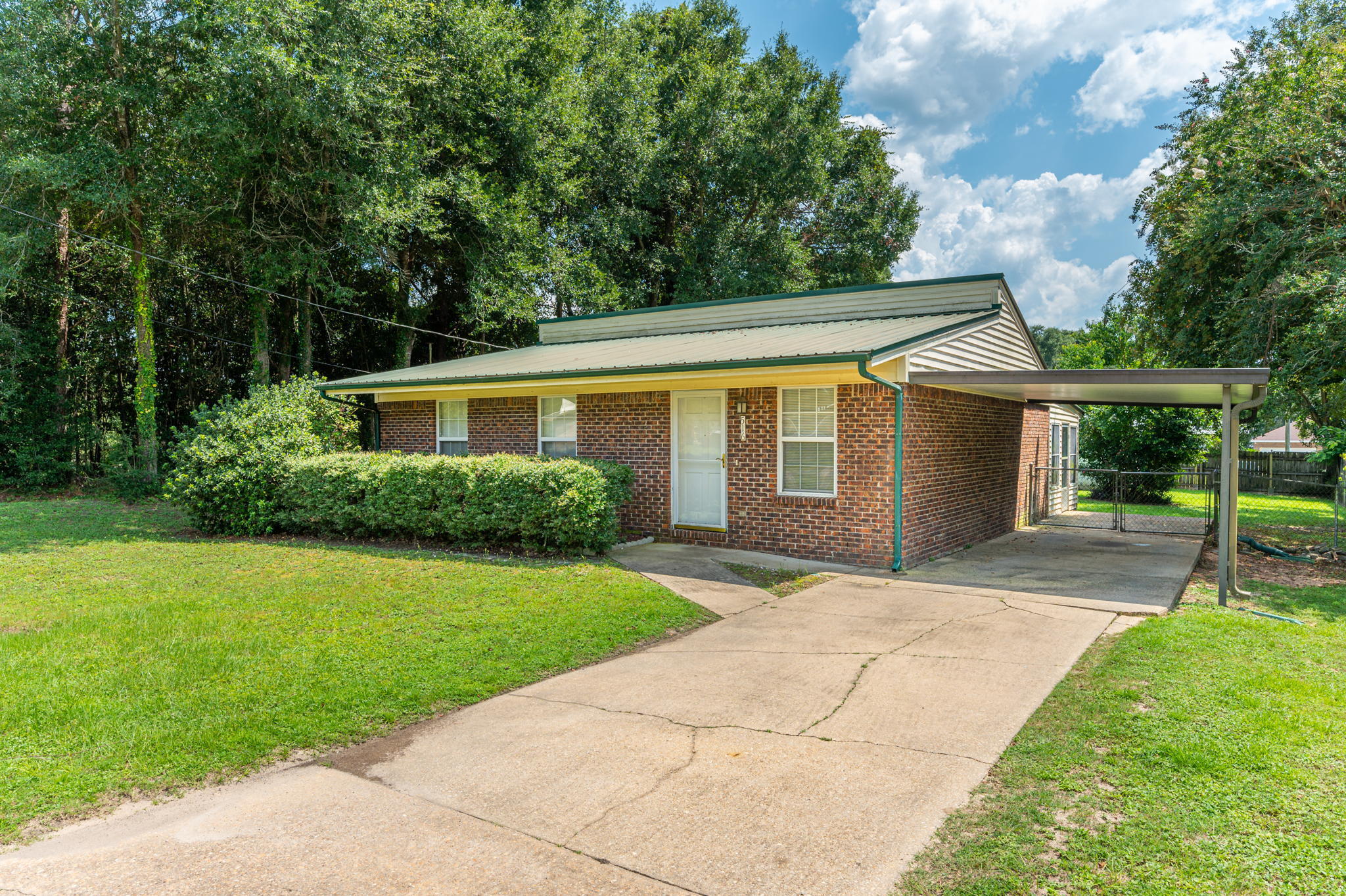 516 Stillwell Boulevard Crestview, FL 32539 - Photo 1 of 22 a front view of a house with a yard