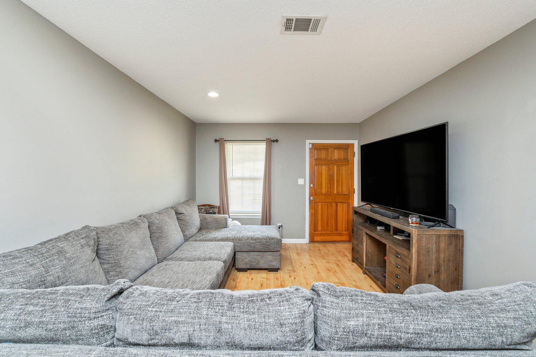 516 Stillwell Boulevard Crestview, FL 32539 - Photo 11 of 22 a living room with furniture and a flat screen tv