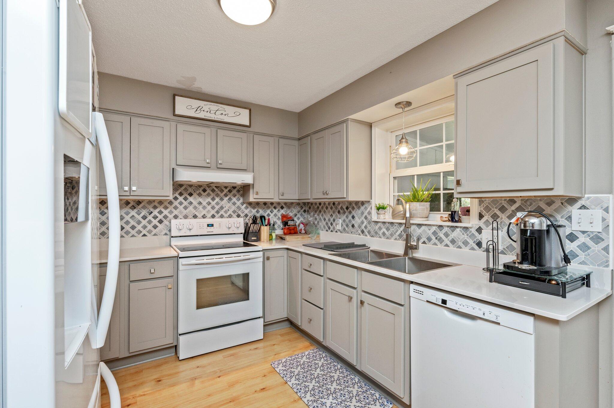 516 Stillwell Boulevard Crestview, FL 32539 - Photo 14 of 22 a kitchen with a sink stove and refrigerator