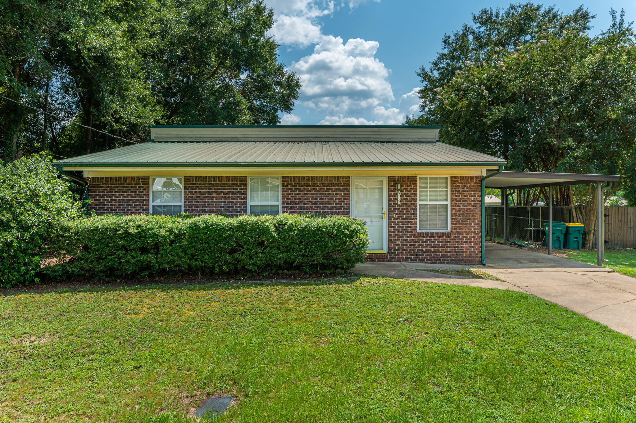 516 Stillwell Boulevard Crestview, FL 32539 - Photo 2 of 22 a front view of a house with a yard