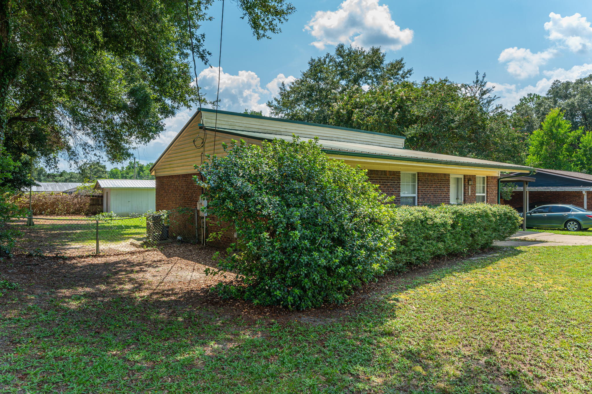 516 Stillwell Boulevard Crestview, FL 32539 - Photo 3 of 22 a front view of a house with garden
