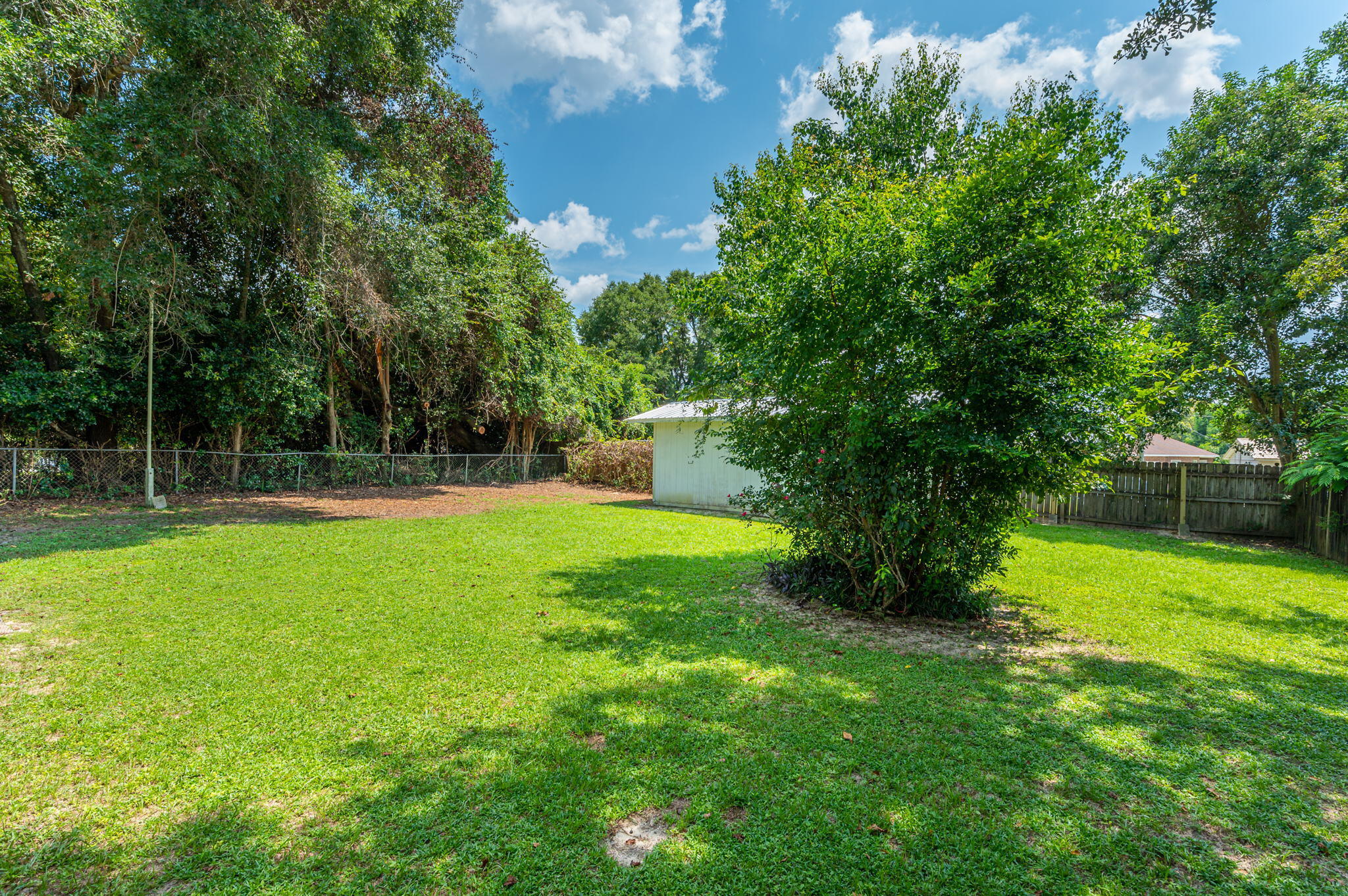 516 Stillwell Boulevard Crestview, FL 32539 - Photo 5 of 22 a view of a house with a backyard