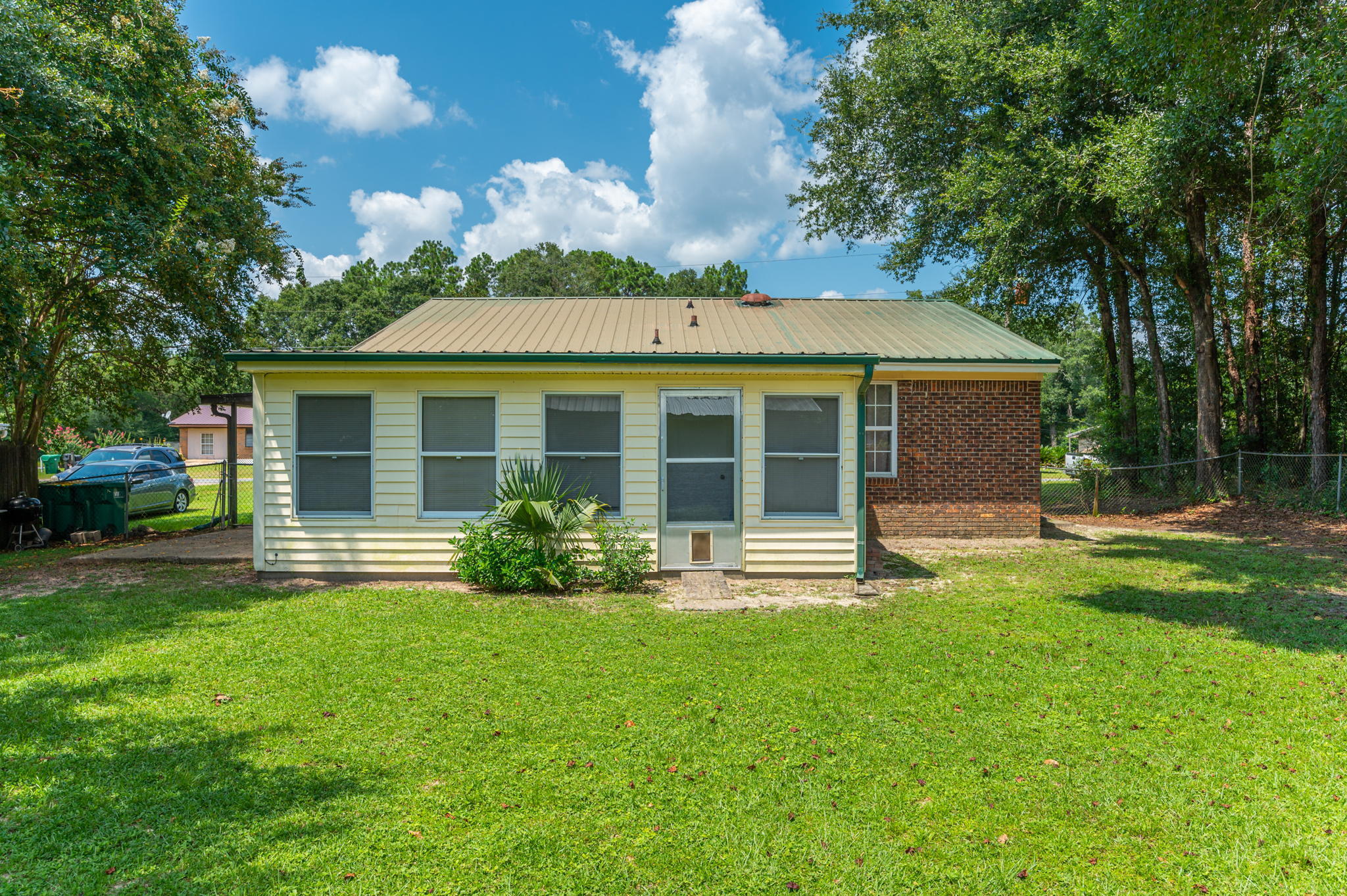 516 Stillwell Boulevard Crestview, FL 32539 - Photo 7 of 22 a front view of a house with a yard and porch