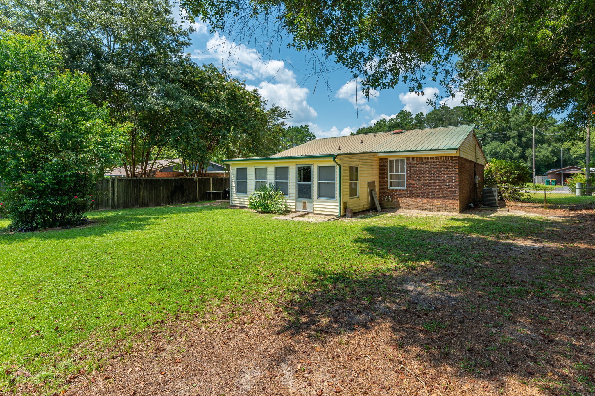 516 Stillwell Boulevard Crestview, FL 32539 - Photo 8 of 22 a view of a house with a yard