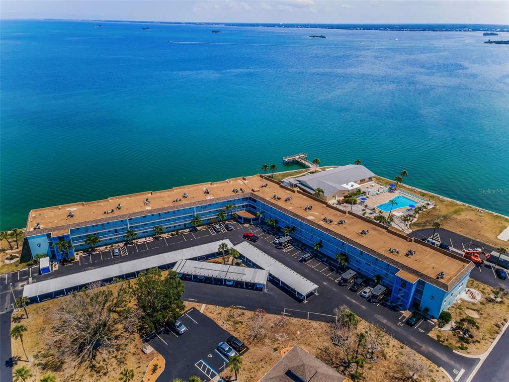 wooden floor with a bed