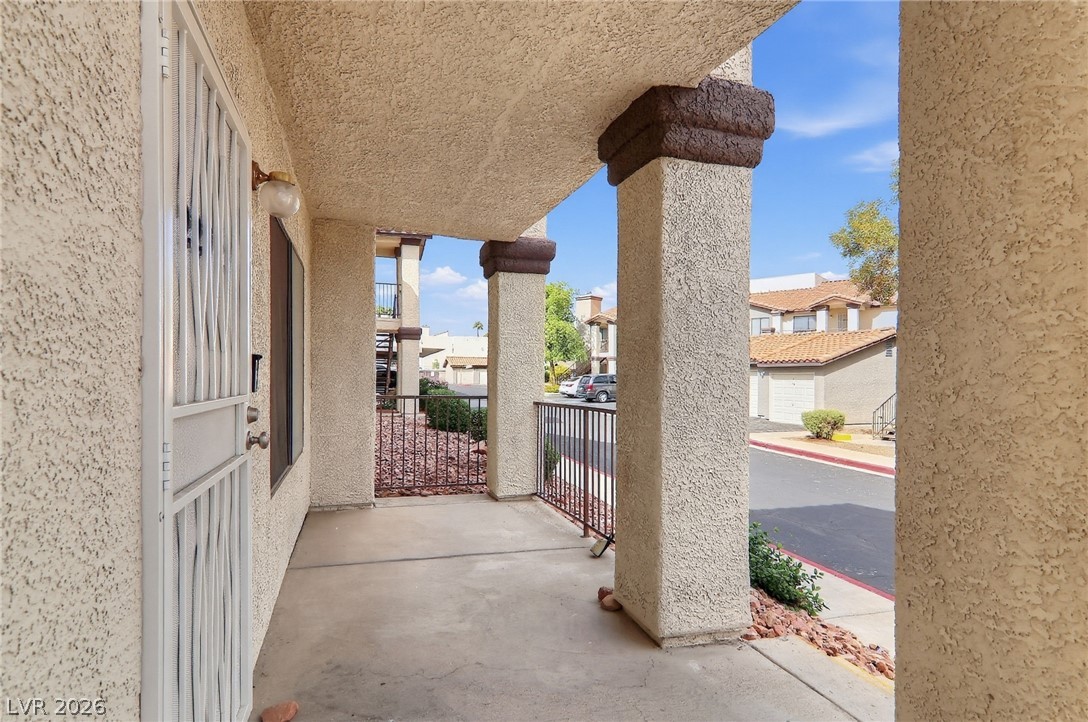 1575 West Warm Springs Road, Unit 2212 Henderson, NV 89014 - Photo 2 of 29 Thick stucco pillars and a covered entryway offer a welcoming transition from the outdoors.