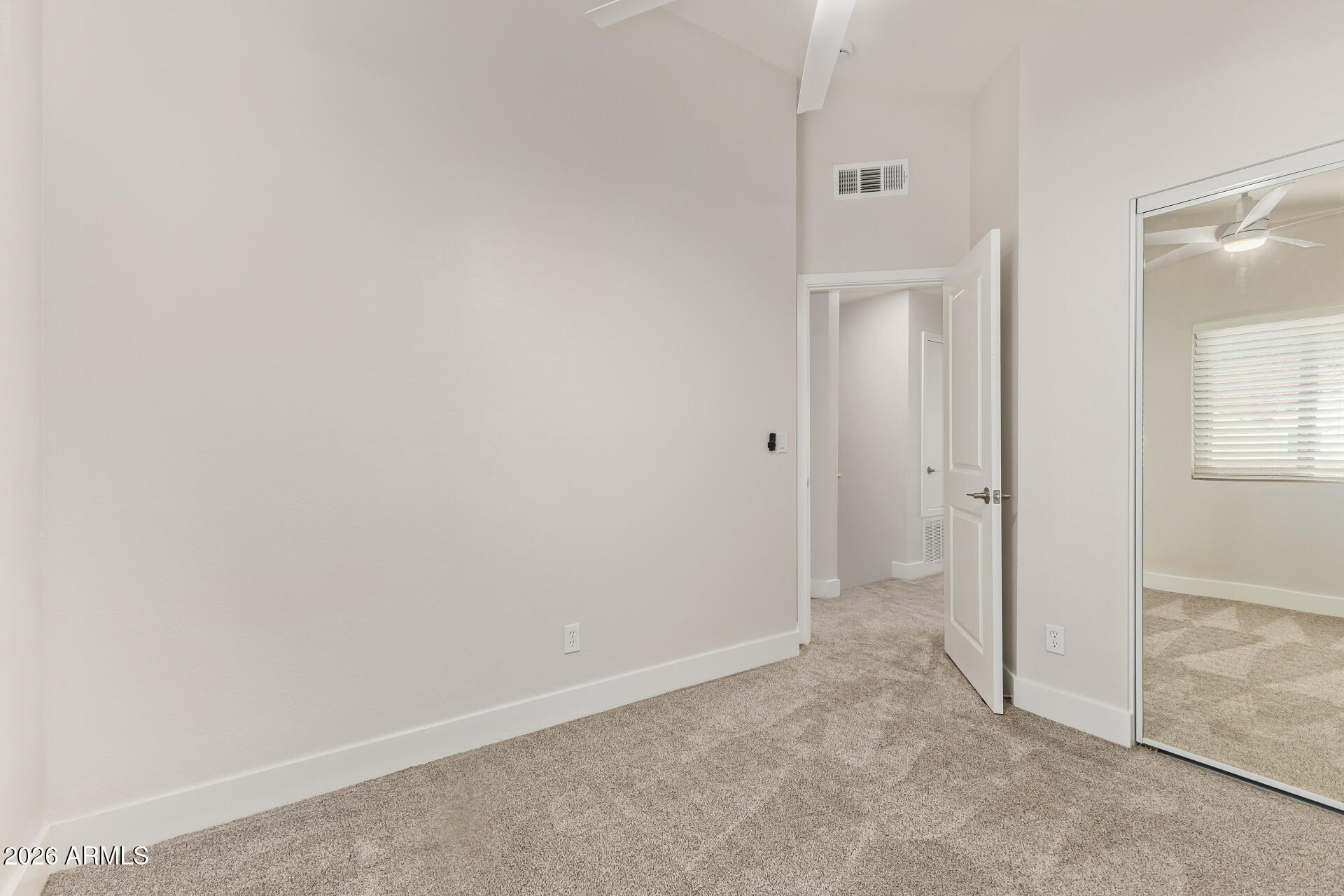 5808 East Brown Road, Unit 90 Mesa, AZ 85205 - Photo 20 of 29 an empty room with windows