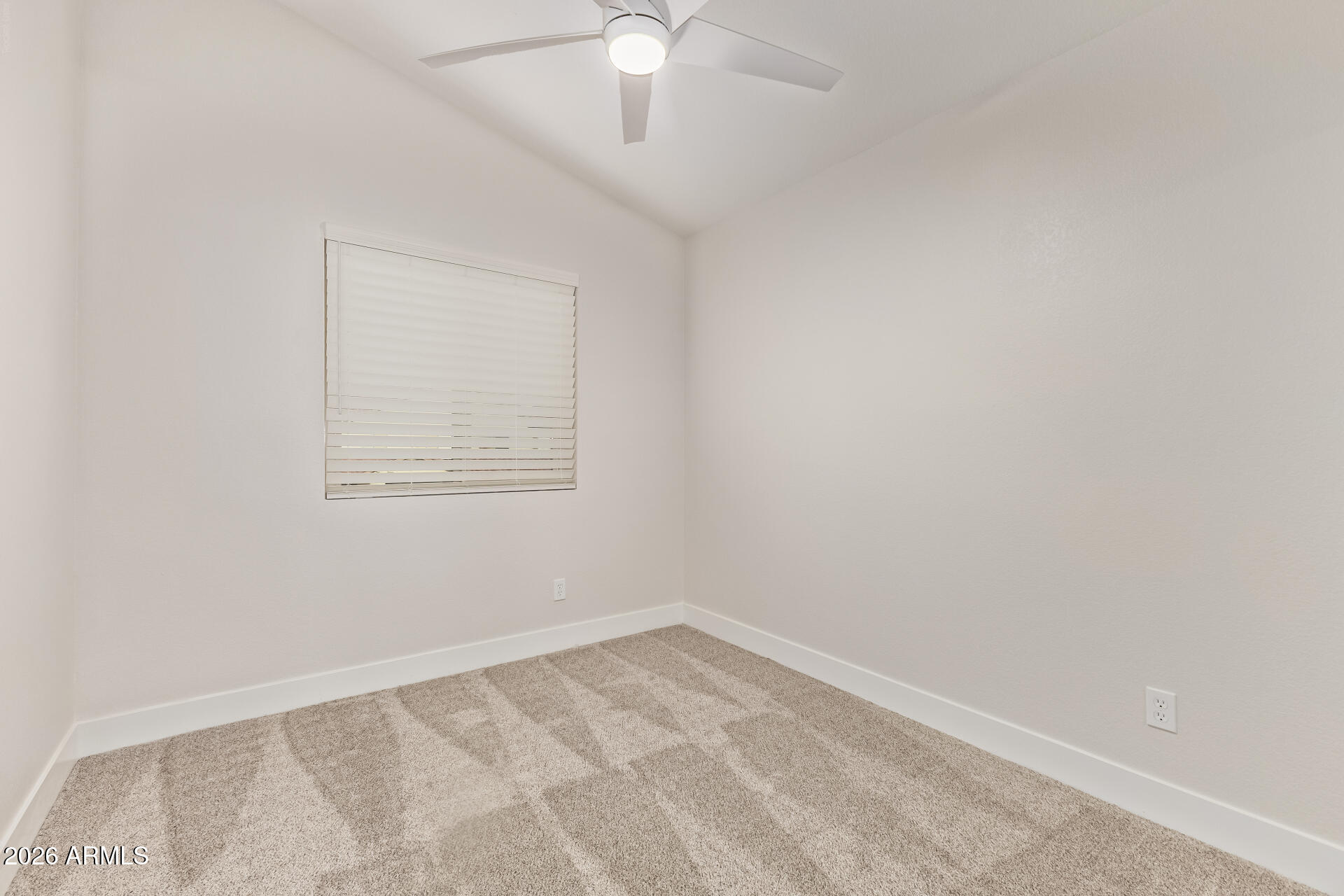 5808 East Brown Road, Unit 90 Mesa, AZ 85205 - Photo 22 of 29 an empty room with a window
