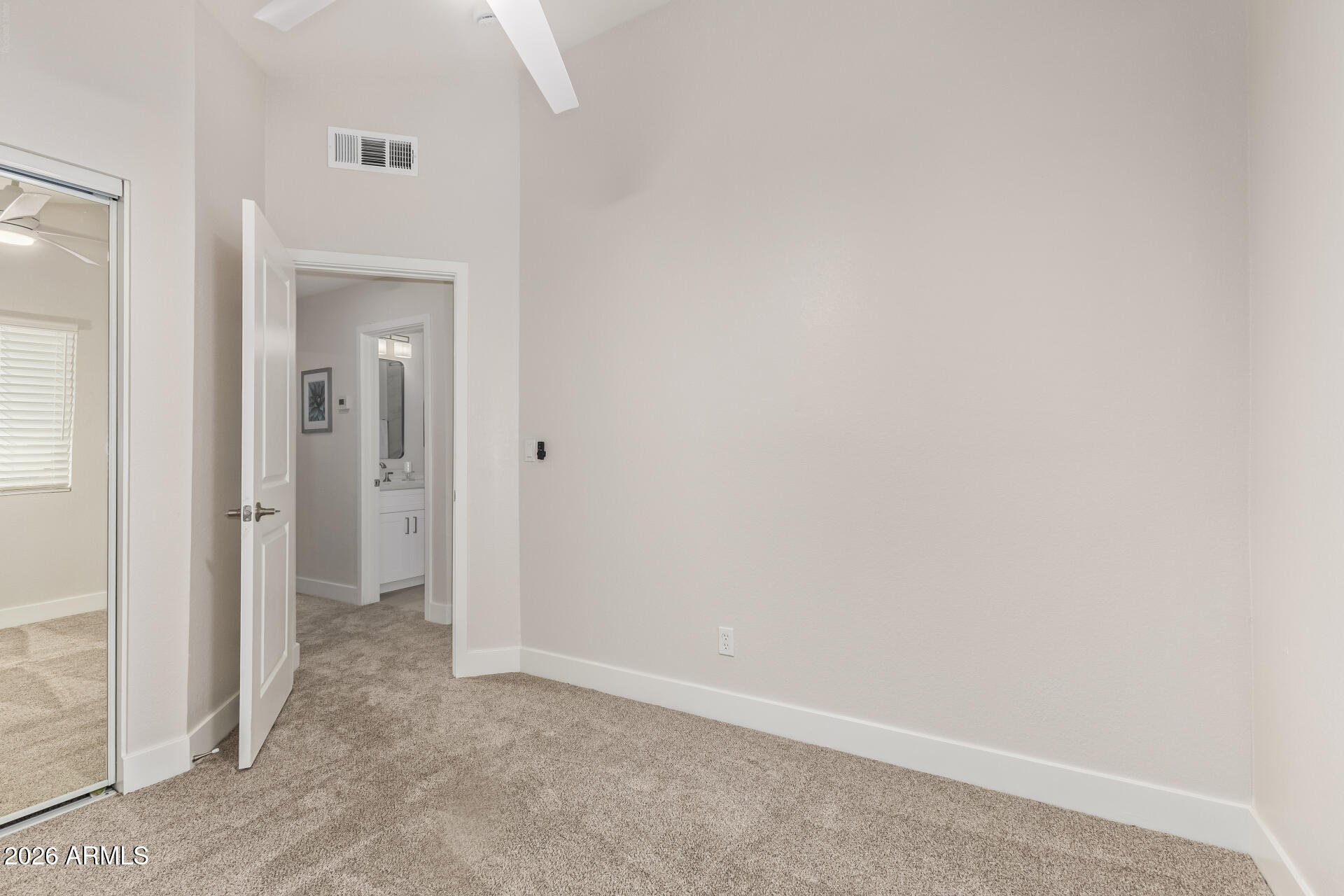 5808 East Brown Road, Unit 90 Mesa, AZ 85205 - Photo 23 of 29 an empty room with closet and a bathroom