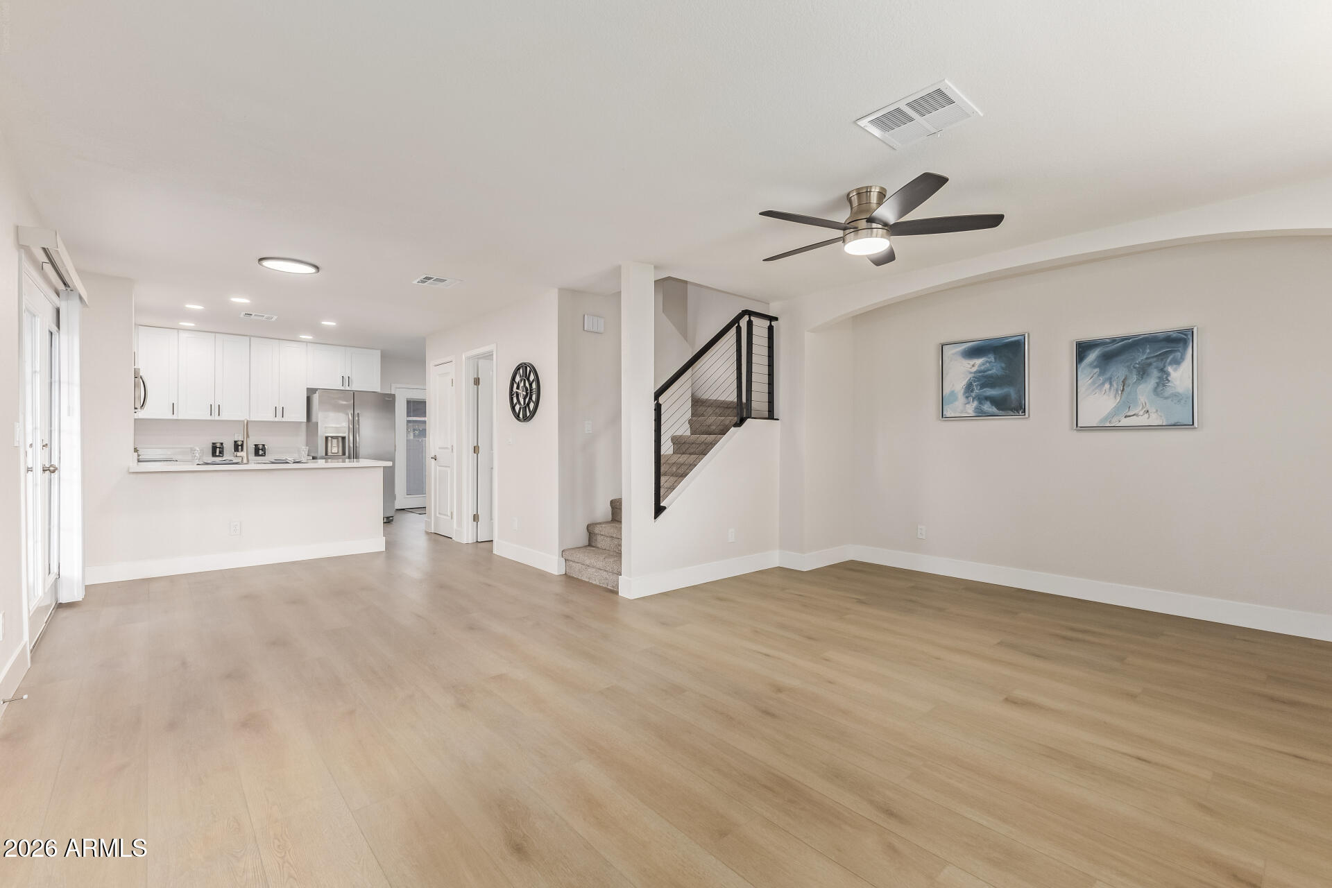 5808 East Brown Road, Unit 90 Mesa, AZ 85205 - Photo 4 of 29 a view of a kitchen with a sink and a refrigerator