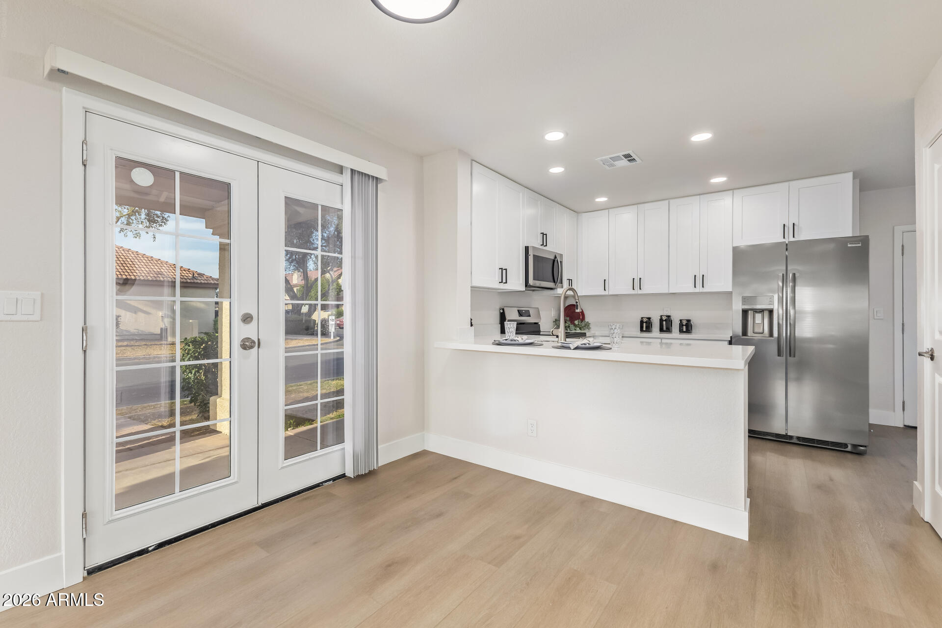 5808 East Brown Road, Unit 90 Mesa, AZ 85205 - Photo 7 of 29 a view of kitchen with stainless steel appliances refrigerator oven and cabinets
