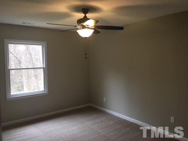 8105 Greywinds Drive Raleigh, NC 27615 - Photo 14 of 18 an empty room with a window