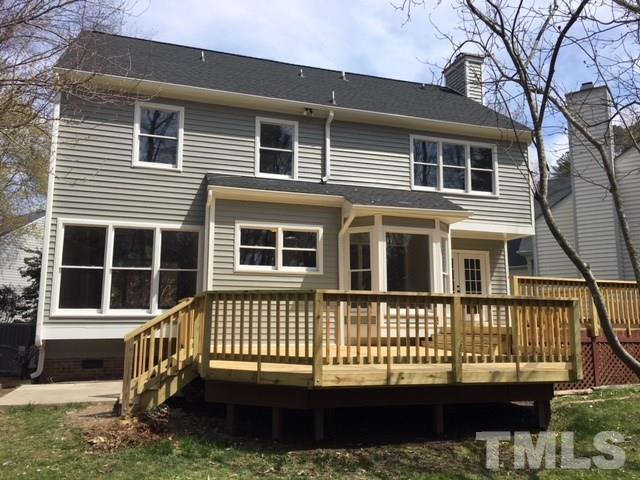 8105 Greywinds Drive Raleigh, NC 27615 - Photo 17 of 18 a front view of a house with a yard