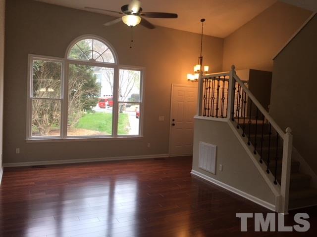 8105 Greywinds Drive Raleigh, NC 27615 - Photo 7 of 18 a view of entryway and hall with wooden floor