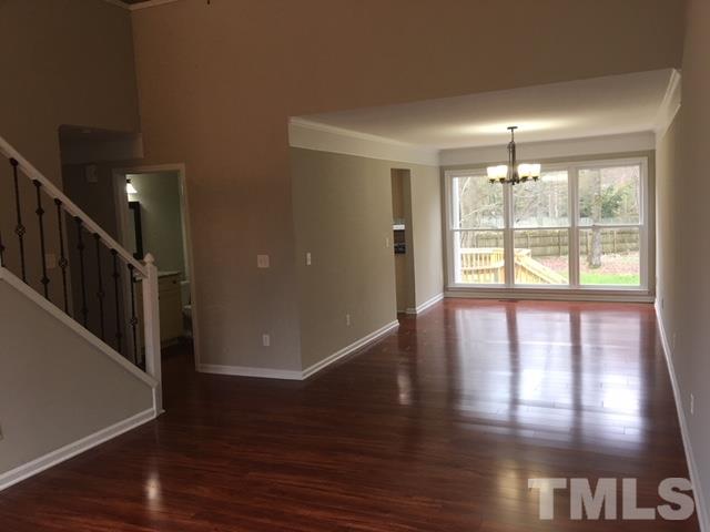 8105 Greywinds Drive Raleigh, NC 27615 - Photo 8 of 18 a view of an entryway with wooden floor