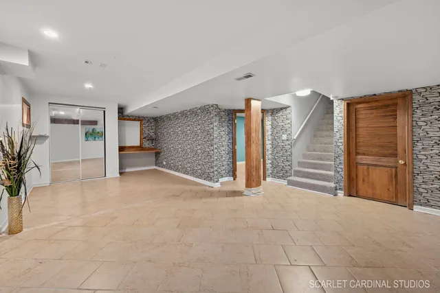 a view of an empty room with a garage