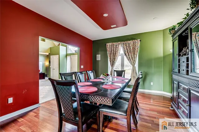 a bathroom with a sink mirror and toilet