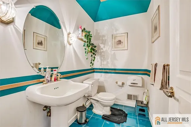 a bathroom with a double vanity sink mirror and double