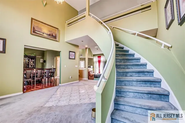 a white toilet sitting next to a bathroom sink