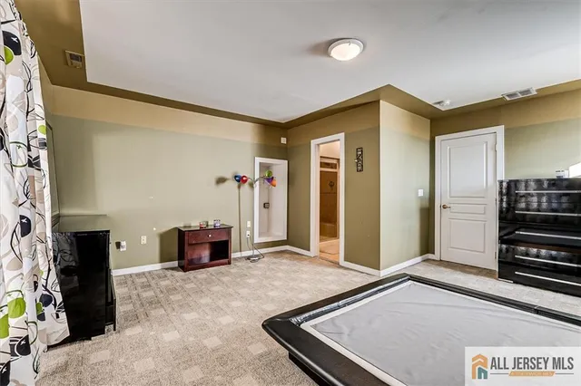 a bed room with a bed and a potted plant