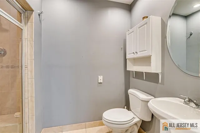 a gym room with lots of furniture and clutter