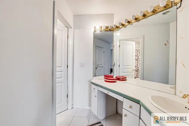 a view of a house with a yard and potted plants