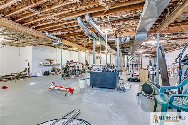 an aerial view of a house with a swimming pool