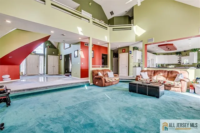 a kitchen with stainless steel appliances kitchen island granite countertop a sink and cabinets