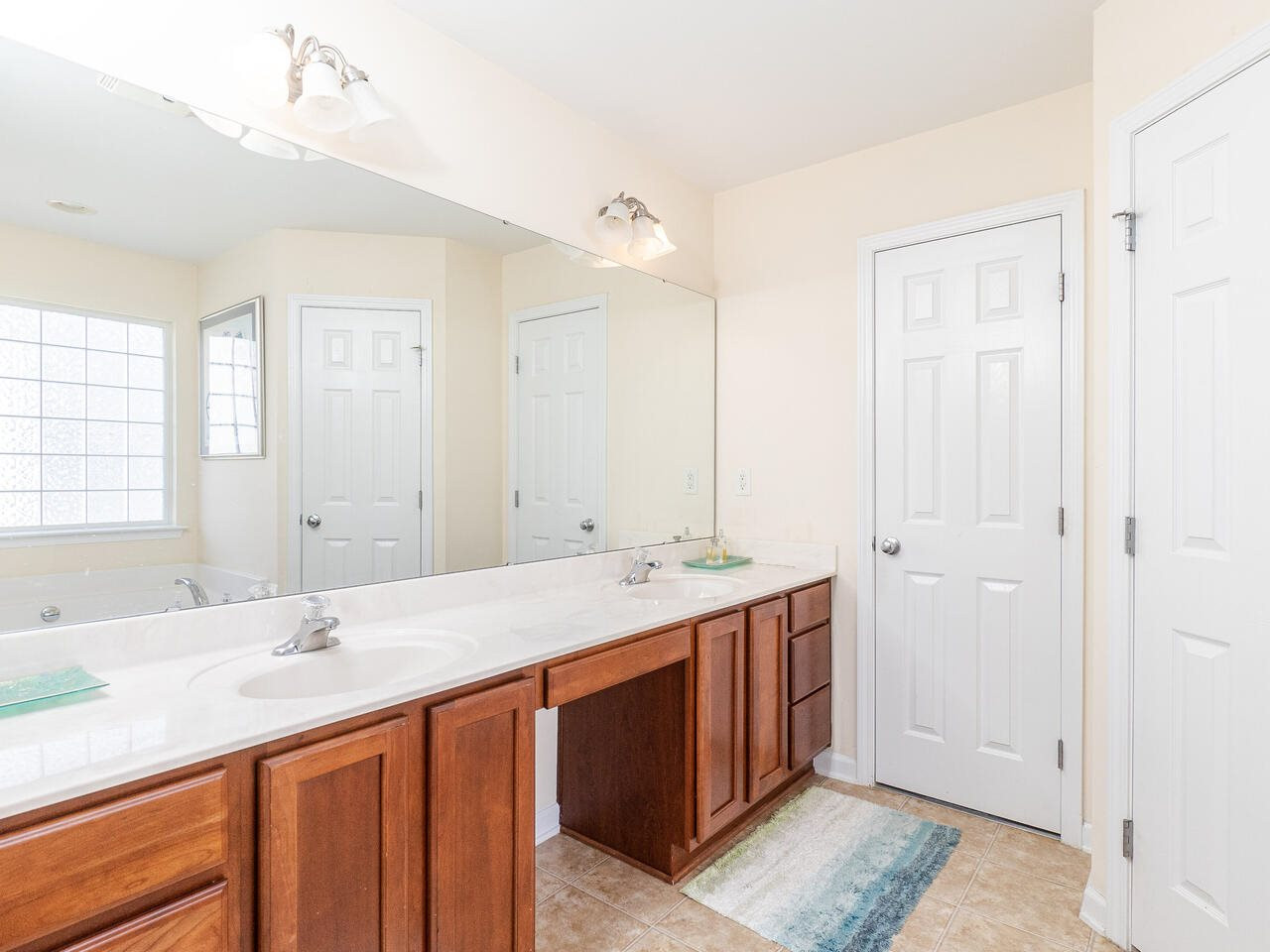 3500 Sunapee Court Raleigh, NC 27616 - Photo 22 of 27 Master bathroom with separate tub and shower also access to walk in storage space MASTER BATH/SPA