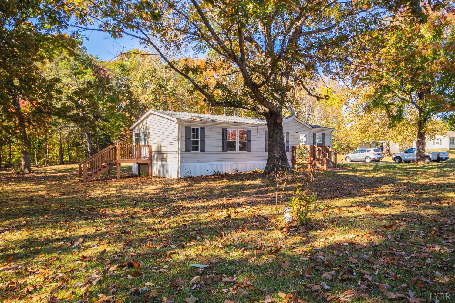 4791 Salem Road Spout Spring, VA 24593 - Photo 15 of 17 a front view of a house with a yard and trees