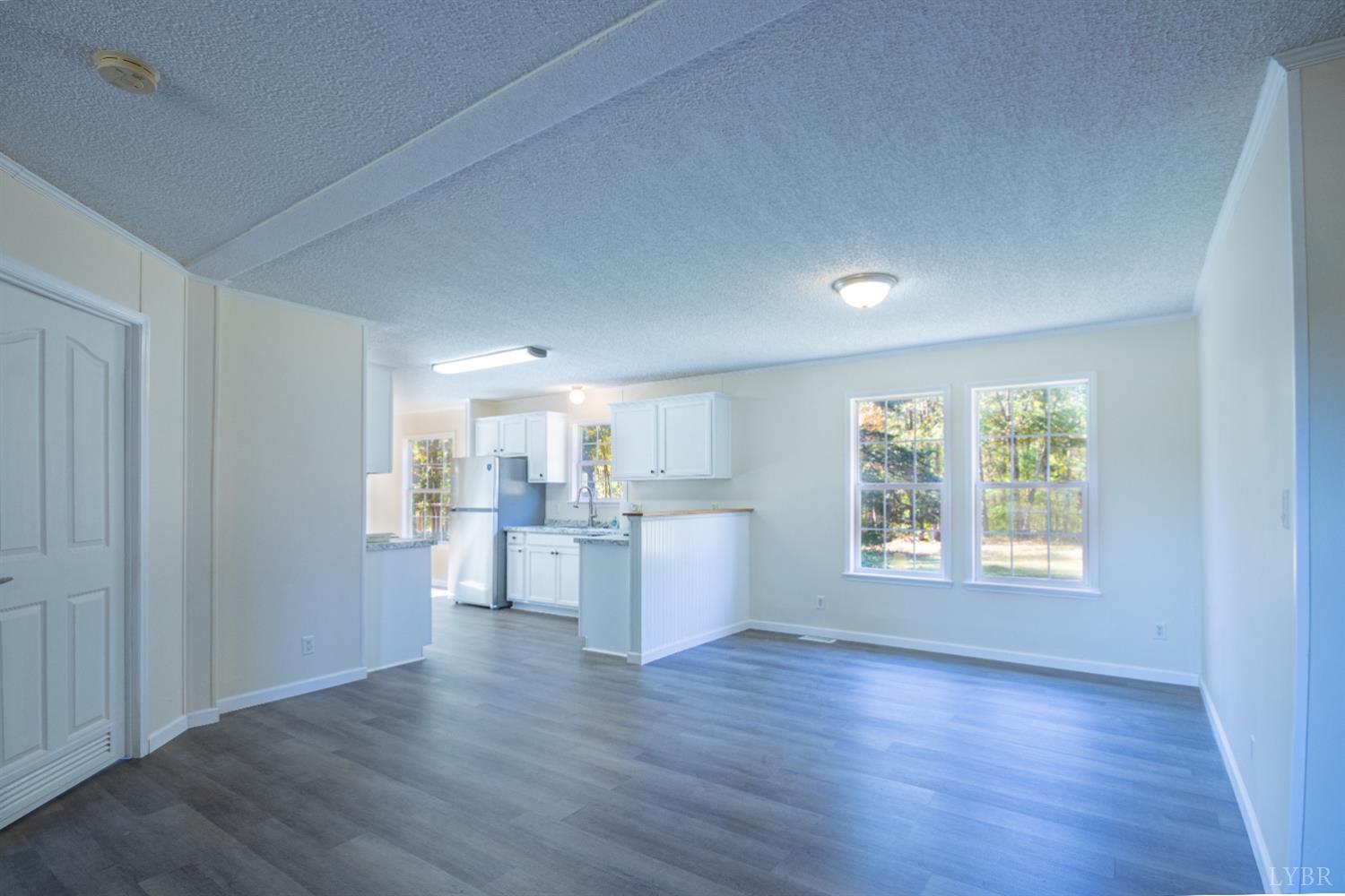 4791 Salem Road Spout Spring, VA 24593 - Photo 2 of 17 a view of a room with window and wooden floor