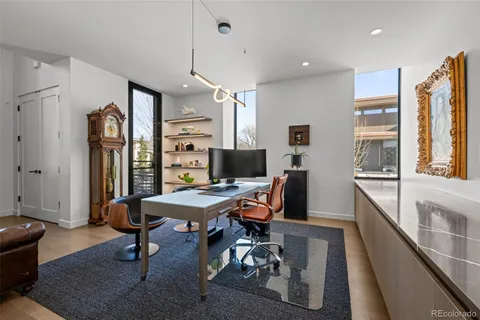 a view of a workspace with furniture and a livingroom
