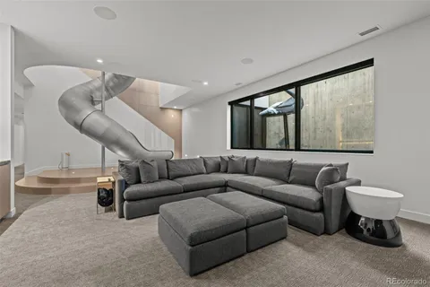 a living room with furniture and a large window