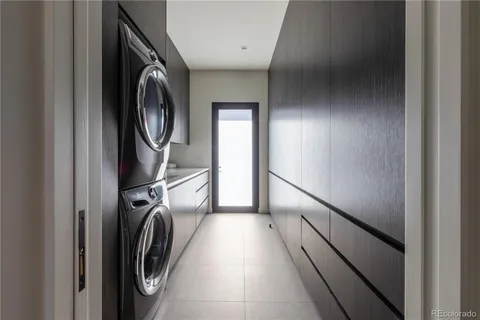 a view of a hallway with washer and dryer