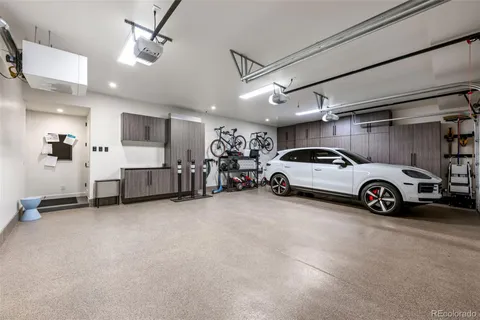 a view of a garage with parked cars