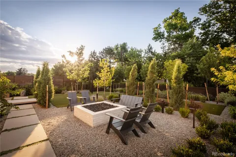 a view of a patio with a table and chairs