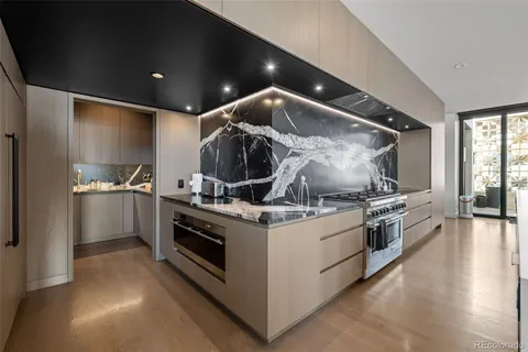 a kitchen with stove and cabinets