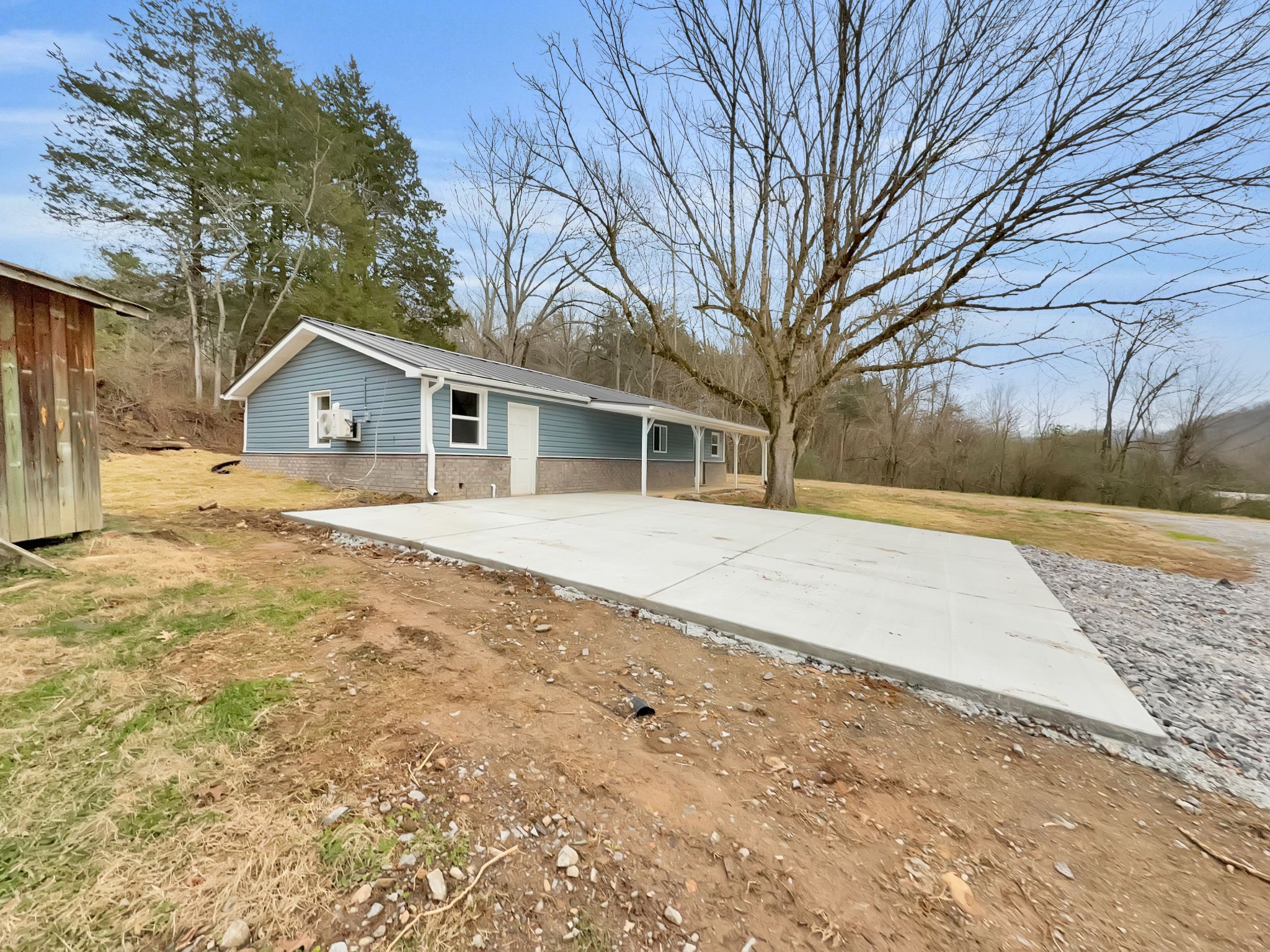 3337 Hartsville Road Lafayette, TN 37083 - Photo 15 of 17 a front view of house with yard and trees around
