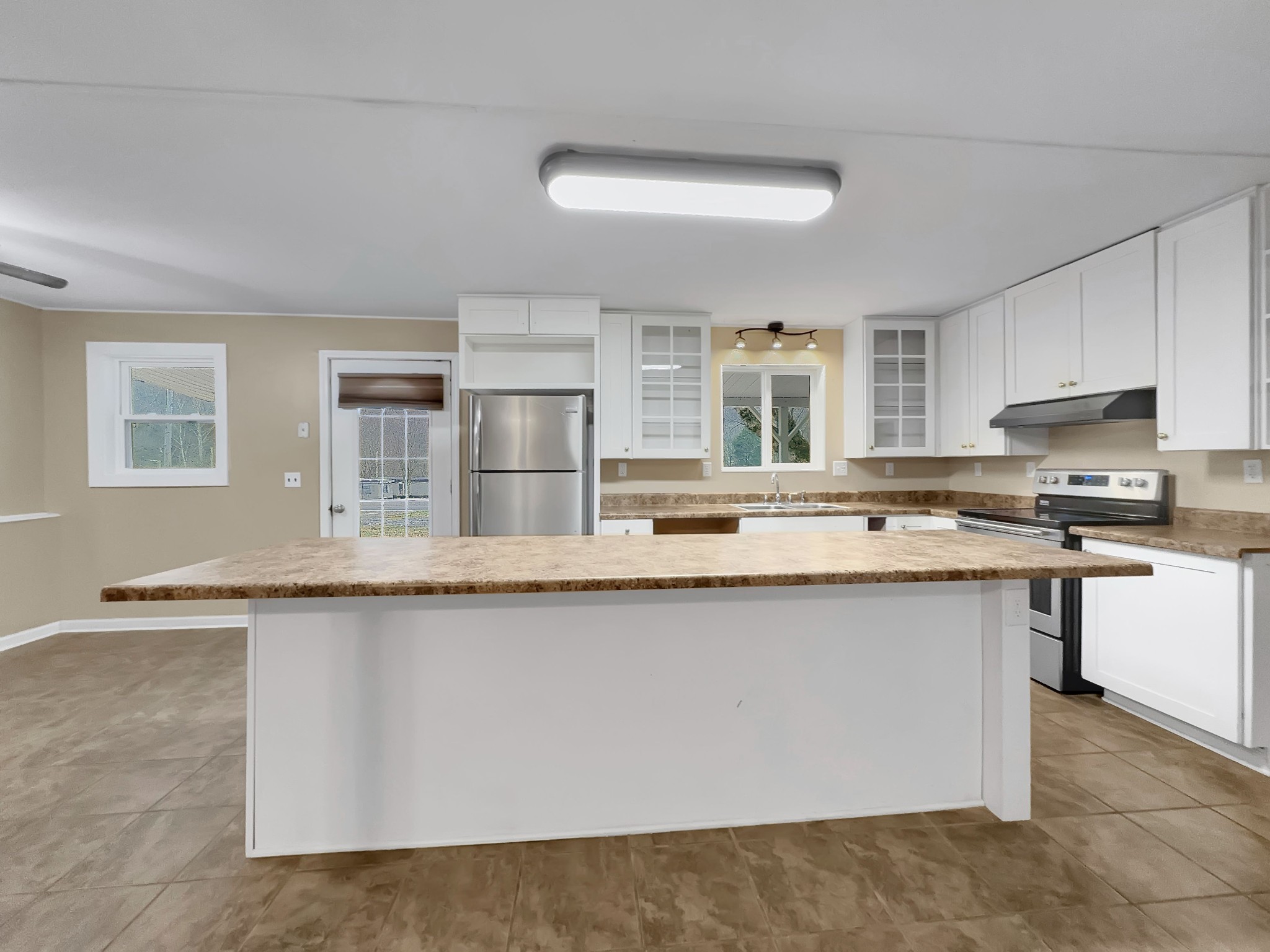 3337 Hartsville Road Lafayette, TN 37083 - Photo 4 of 17 a kitchen with stainless steel appliances granite countertop a sink and cabinets