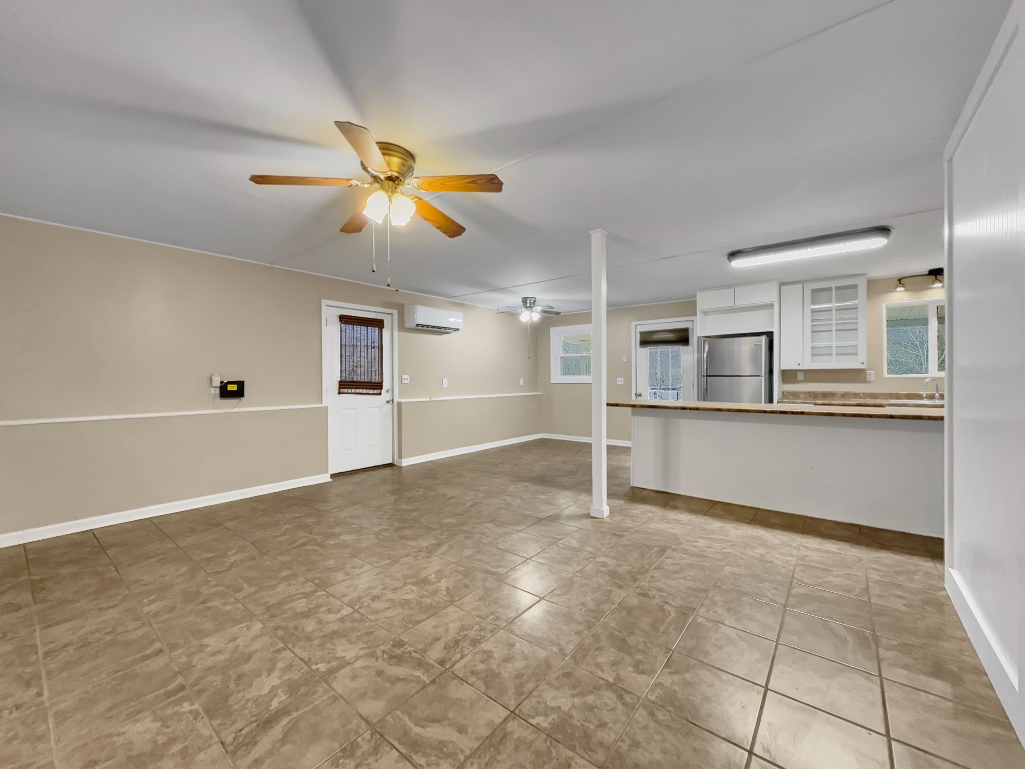 3337 Hartsville Road Lafayette, TN 37083 - Photo 6 of 17 a view of a kitchen with wooden cabinet and a refrigerator