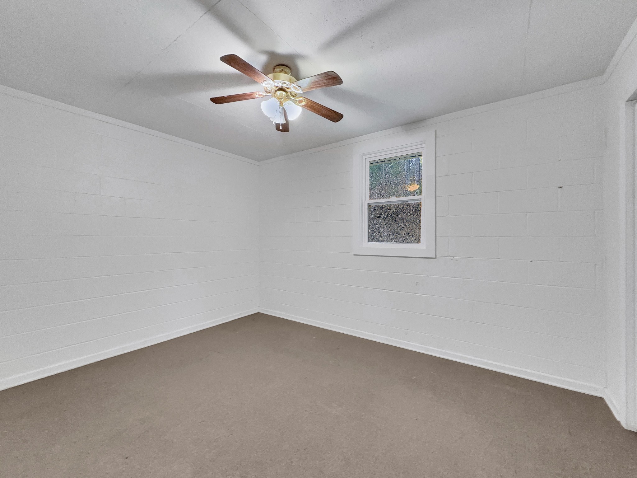 3337 Hartsville Road Lafayette, TN 37083 - Photo 10 of 17 an empty room with windows and fan
