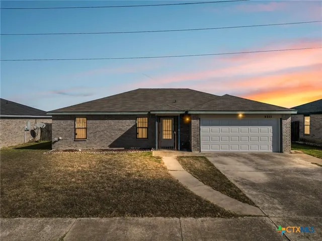 a front view of a house with yard