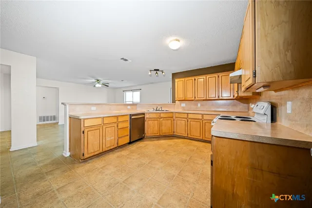 an empty room with a window and a table