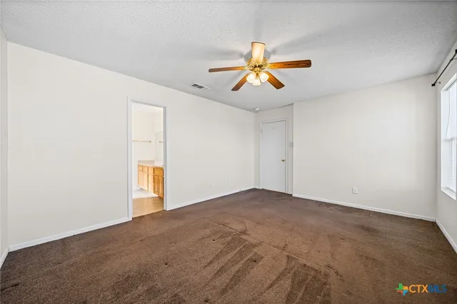 a spacious bathroom with sinks mirror and a bathtub