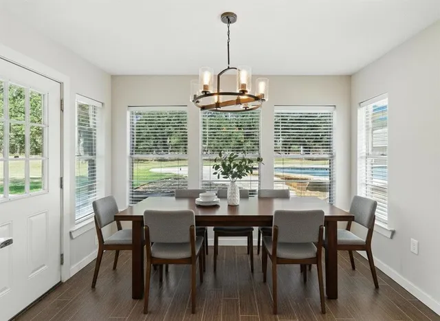 a view of a dining room with furniture window and outside view