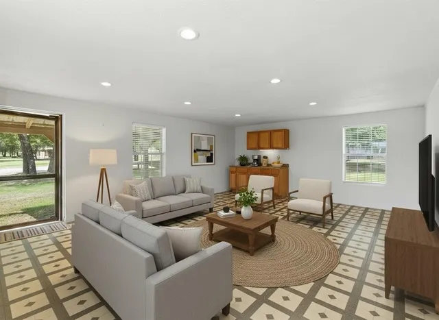 a living room with furniture and a flat screen tv