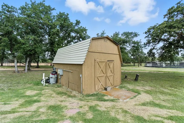 a backyard of a house with lots of green space