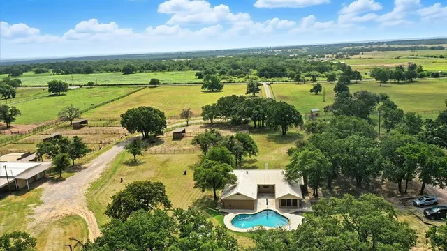 a view of a lake with houses in the back