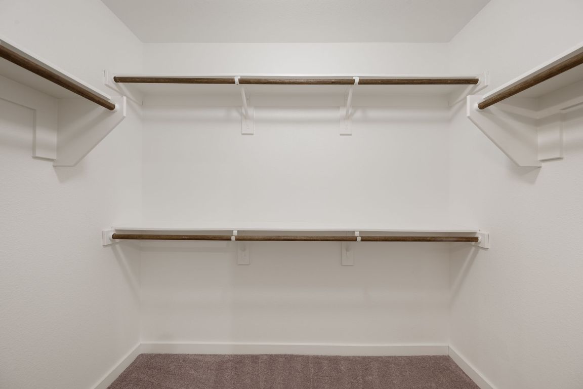 602 Knopper Street, Unit B Pflugerville, TX 78660 - Photo 17 of 26 Spacious closet with dark carpet