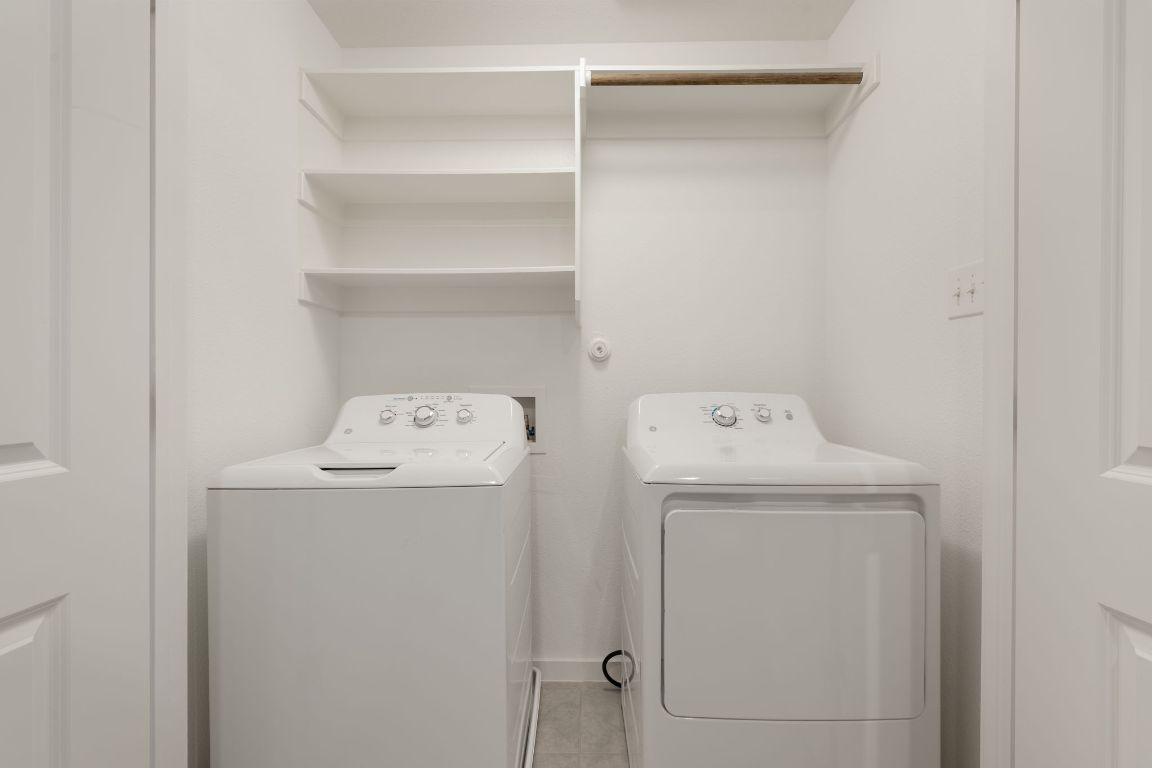 602 Knopper Street, Unit B Pflugerville, TX 78660 - Photo 22 of 26 Laundry room with independent washer and dryer and light tile patterned floors